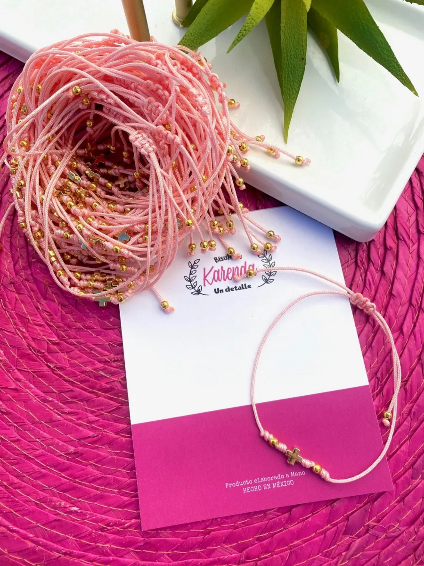 KD090007- Docena de Pulseras con Dije Mini de Cruz con Nuditos (NO INLCUYE TARJETA)